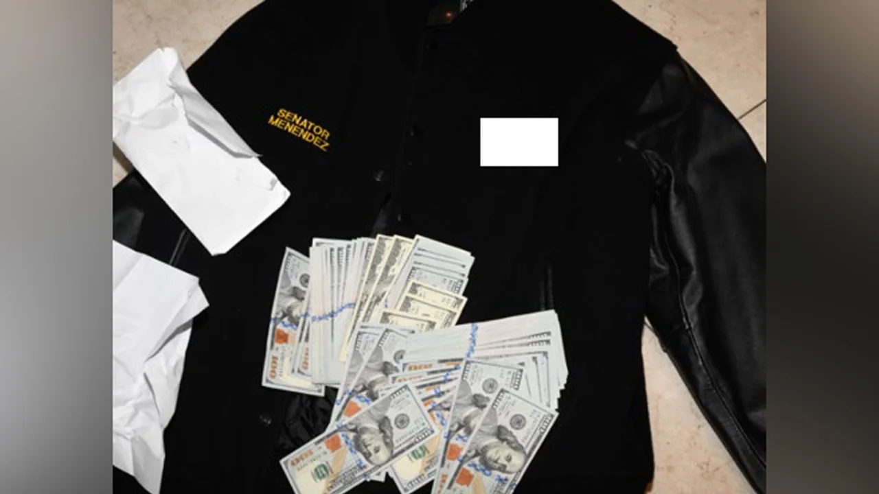 A photo of a jacket and cash from the indictment of Sen. Bob Menendez, found during a 2022 search by federal agents. Investigators found over $480,000 in cash in his New Jersey home.