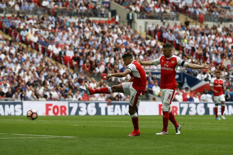 Nigeria News / Adrian DENNISArsenal's Chilean striker Alexis Sanchez (L) shoots to score the opening goal against Chelsea at their English FA Cup final at Wembley stadium in London on May 27, 2017