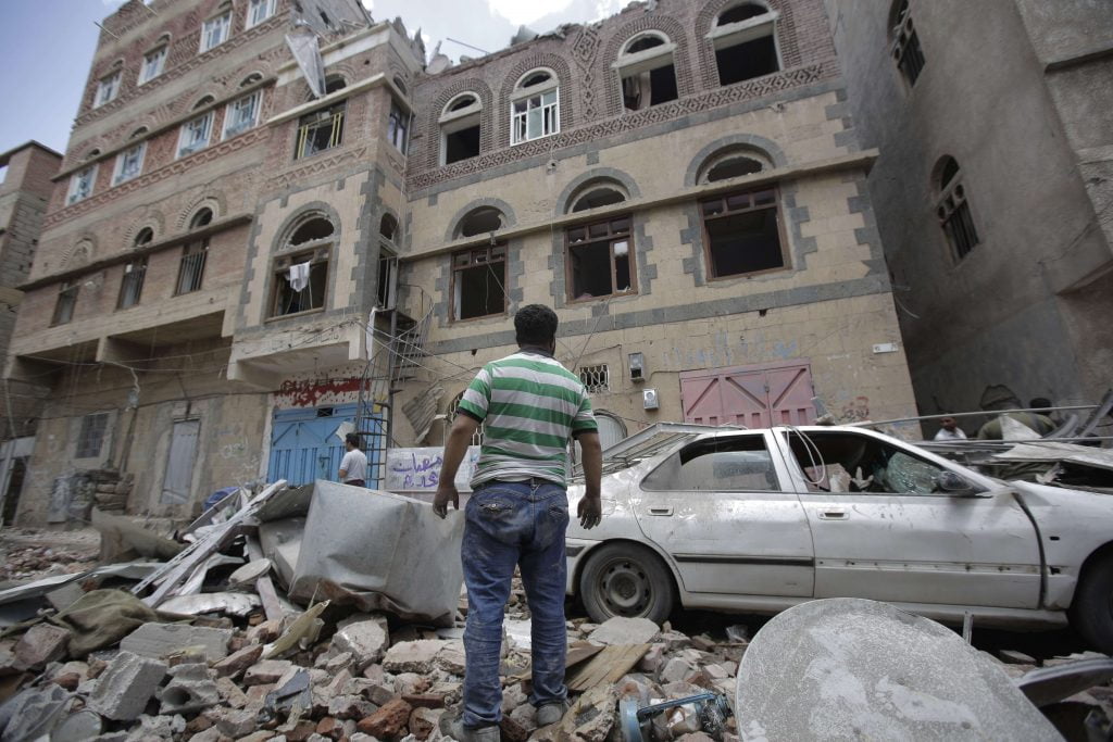 A man observes the damage caused by a coalition bombing on the Yemeni capital, Sanaa, on May 16, 2019. © Hani Mohammed / AP / SIPA