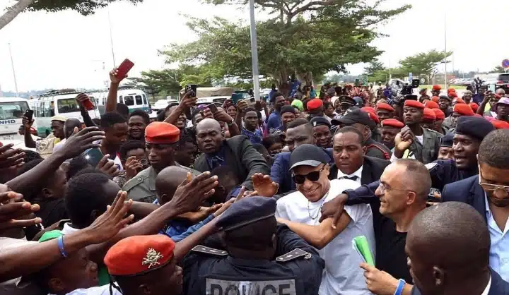 Fans trying to touch Kylian Mbappe as he visits Cameroon on Thursday.