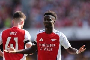 Bukayo Saka celebrates after scoring for Arsenal in their Premier League opener.