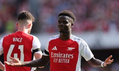 Bukayo Saka celebrates after scoring for Arsenal in their Premier League opener.