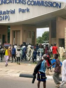 ‘Millions Of Naira Down The Drain’, FG Cries As Protesters Vandalize NCC Building In Kano