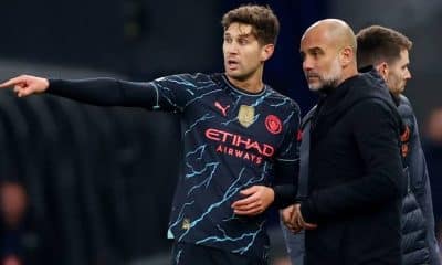 Pep Guardiola and John Stones